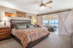 Barn doors to the master bedroom right off the living room